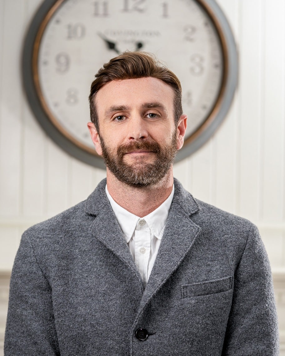 Nick Cies, Business Development Staff Member. Professional headshot of business man in gray jacket and white shirt.